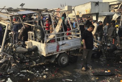 Isis forces west of Baghdad, killing at least 7, security sources say