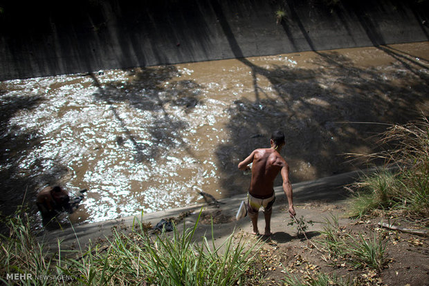 Searching for gold in wastewater channels in Venezuela