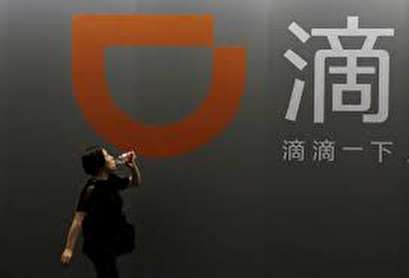 As China's Didi looks abroad, challenges spring up at home
