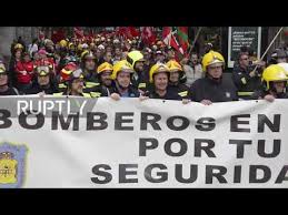 Spain firefighters march to demand better working conditions