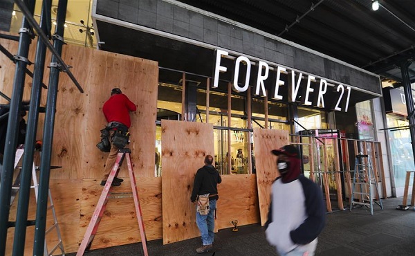 People board up stores in New York