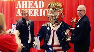 Conservatives show loyalty to Trump at CPAC with golden statue of ex-president