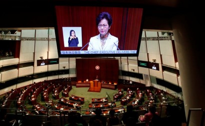 Hong Kong leader says to cut taxes, ease housing crunch in maiden policy address