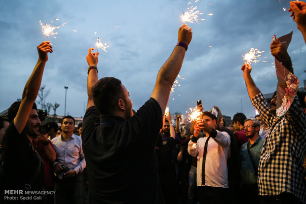 Photos of Rouhani’s supporters celebrating his victory in election