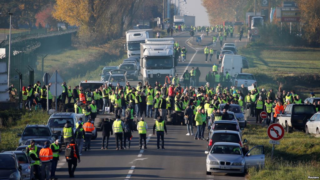 Drivers block France streets, protest rising tax on fuel