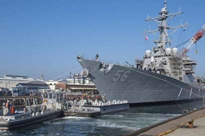 USS John S. McCain transfers from dry dock to pier following collision repairs