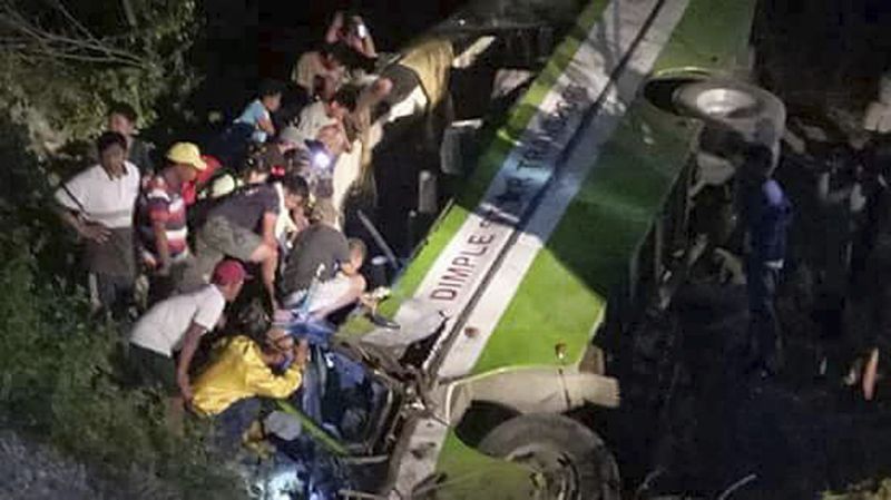 Philippine bus careens into ravine, killing 19, injuring 17