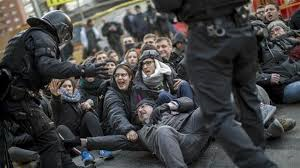 Police clash with protesters taking part in Catalonia strike