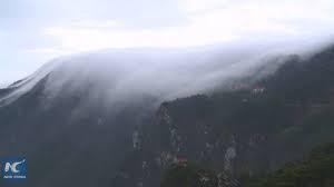 Waterfall of clouds cascade down China's Lushan Mountain