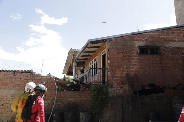 At Least One Killed in Bolivian Air Force Plane Crashes into Residential House