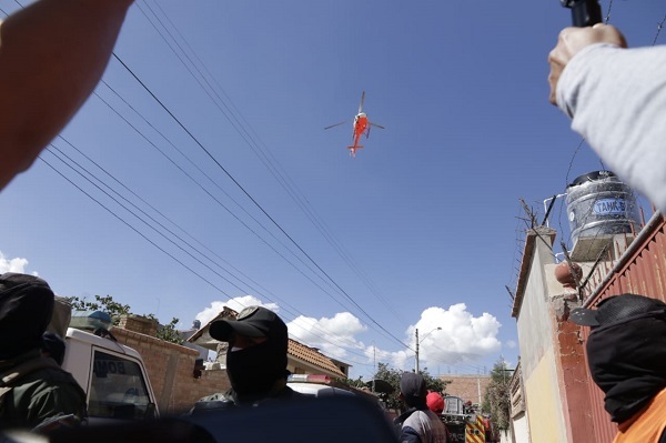 At Least One Killed in Bolivian Air Force Plane Crashes into Residential House