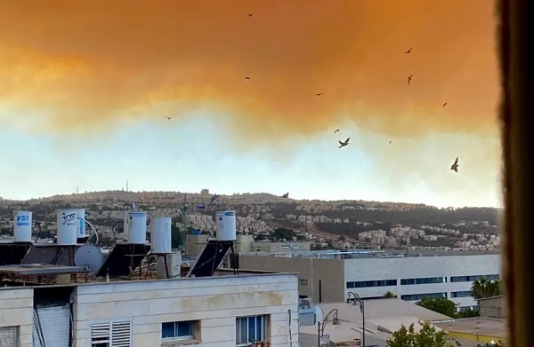 Massive fire sends dark cloud over Jerusalem, engulfs nearby communities